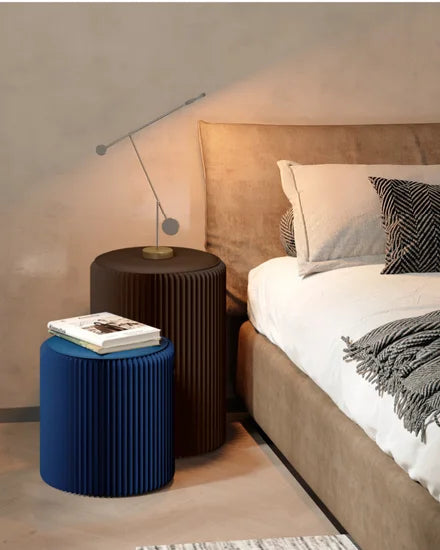 dark blue space-saving folding stool fits under sofa